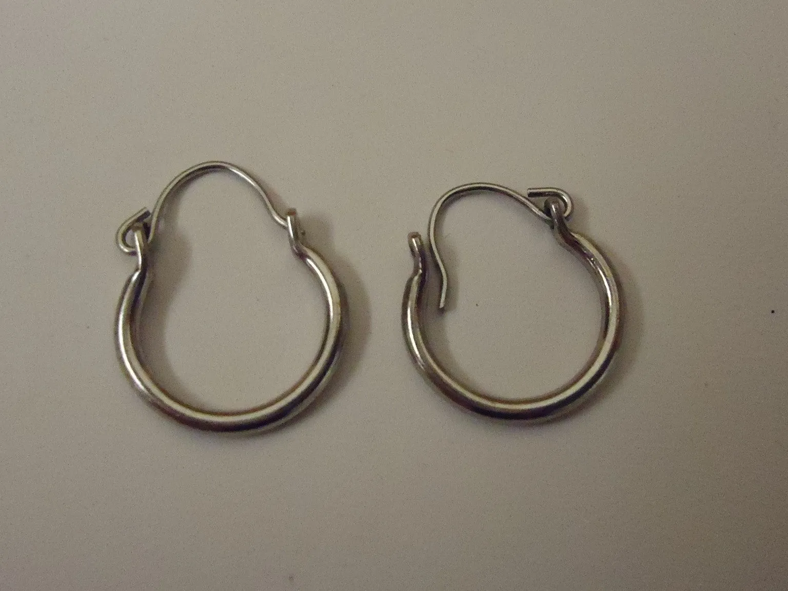 Designer Fashion Earrings 3/8in Diameter Hoop Metal Female Adult Metalics -- Used